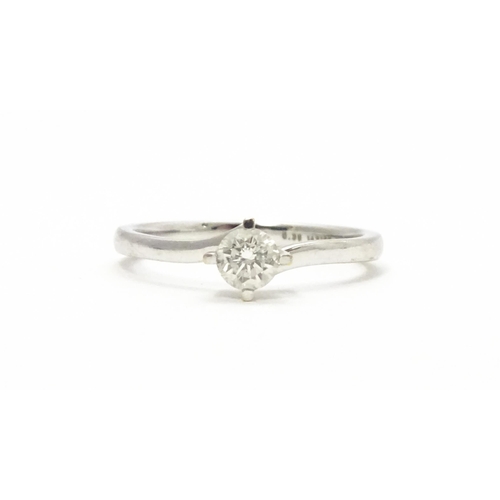 813 - A 18ct white gold ring set with diamond solitaire. Ring size approx. K 1/2