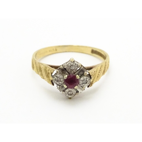 820 - A 9ct gold ring set with central ruby bordered by four diamonds. Ring size approx. M