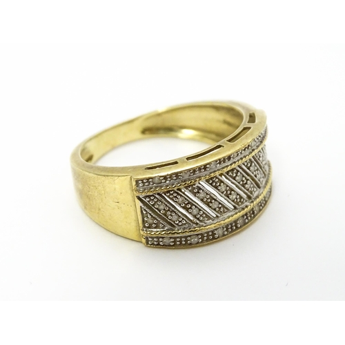 826 - A 9ct gold gentleman's ring set with diamonds. Ring size approx. V