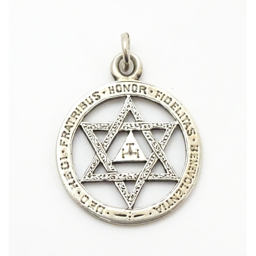 837 - Freemasonary / Masonic interest :  A white metal jewel / pendant with Latin inscription/ Approx 1