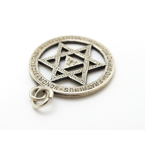 837 - Freemasonary / Masonic interest :  A white metal jewel / pendant with Latin inscription/ Approx 1
