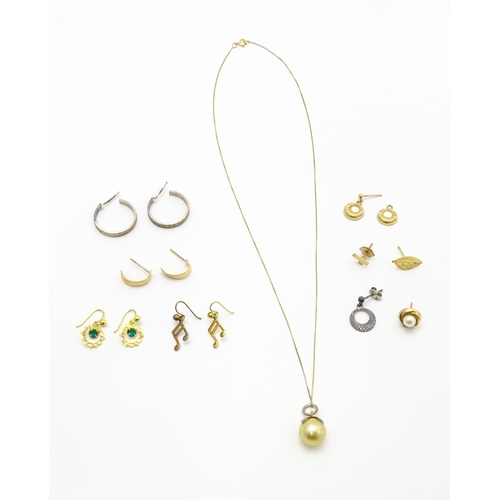 844 - A quantity of assorted gold, yellow metal and silver drop earrings, a gilt metal pendant and a 9ct g... 