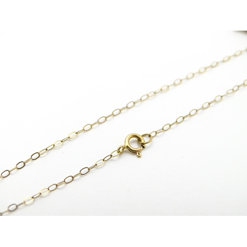 856 - A 9ct gold pendant of dolphin form on a 9ct gold chain. Pendant approx. 1 3/4