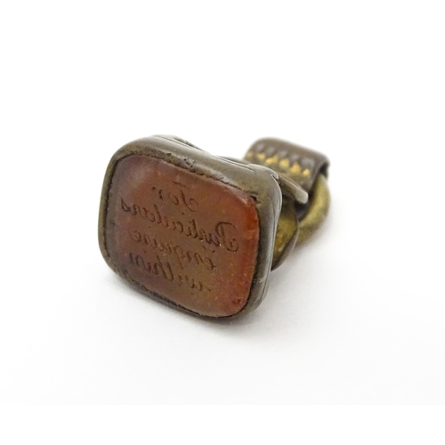 863 - A Victorian fob with engraved seal under. Together with a hallmarked silver locket of oval form with... 