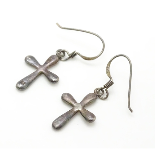 867 - A pair of .925 silver drop earrings with cross detail. Approx. 1