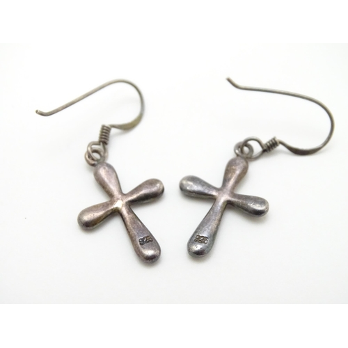 867 - A pair of .925 silver drop earrings with cross detail. Approx. 1