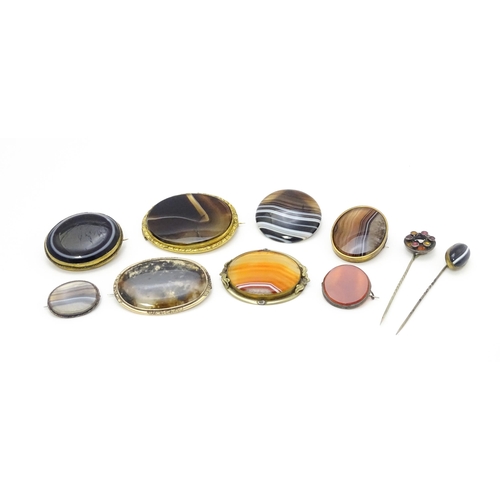 871 - A quantity of assorted Victorian and later brooches, stick pins, etc. set with various hardstone det... 