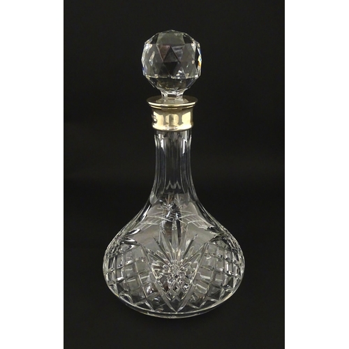 241 - A cut glass decanter with silver collar hallmarked Birmingham 1995 maker C J Vander Ltd. Approx. 11 ... 