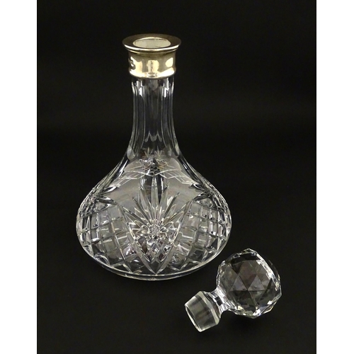 241 - A cut glass decanter with silver collar hallmarked Birmingham 1995 maker C J Vander Ltd. Approx. 11 ... 