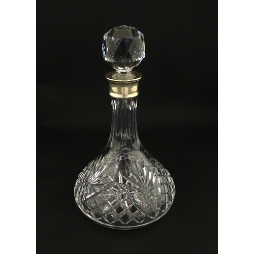 241 - A cut glass decanter with silver collar hallmarked Birmingham 1995 maker C J Vander Ltd. Approx. 11 ... 