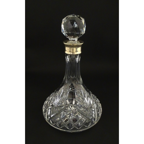 241 - A cut glass decanter with silver collar hallmarked Birmingham 1995 maker C J Vander Ltd. Approx. 11 ... 