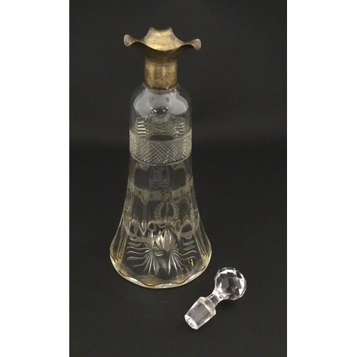 265 - A cut glass decanter with silver mounts hallmarked Birmingham 1911. Approx. 9 1/4