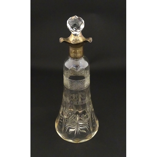 265 - A cut glass decanter with silver mounts hallmarked Birmingham 1911. Approx. 9 1/4