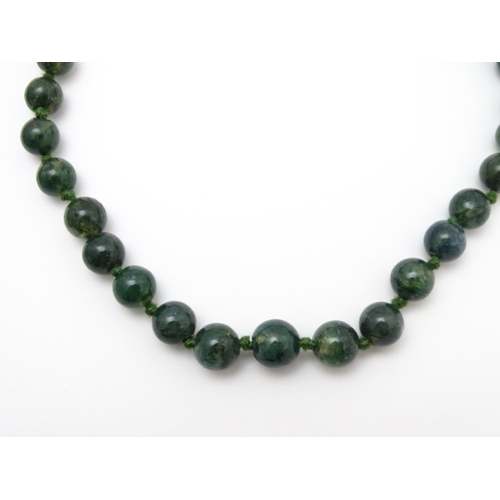 889 - A quantity of assorted green bead necklaces to include jade coloured beads, hardstone, malachite, et... 