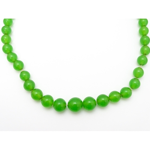 889 - A quantity of assorted green bead necklaces to include jade coloured beads, hardstone, malachite, et... 