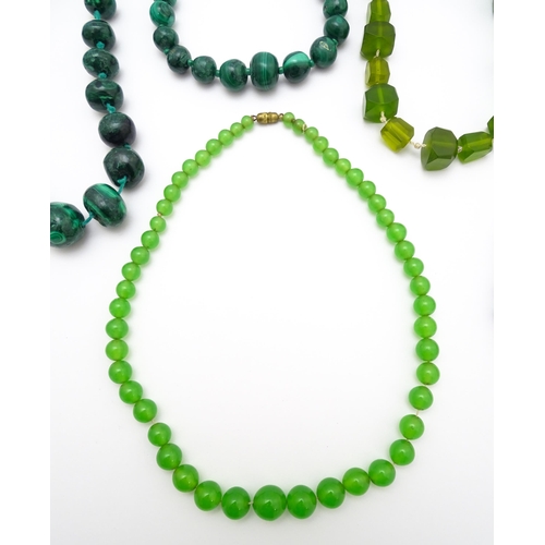 889 - A quantity of assorted green bead necklaces to include jade coloured beads, hardstone, malachite, et... 