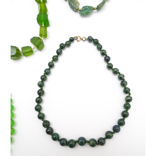 889 - A quantity of assorted green bead necklaces to include jade coloured beads, hardstone, malachite, et... 