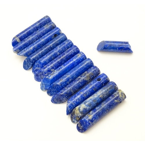 897 - A quantity of lapis lazuli hardstone beads of cylindrical form. Approx. 1 1/2