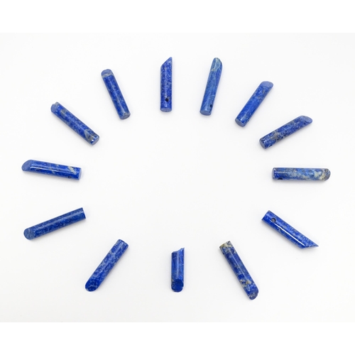 897 - A quantity of lapis lazuli hardstone beads of cylindrical form. Approx. 1 1/2