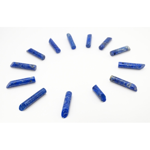 897 - A quantity of lapis lazuli hardstone beads of cylindrical form. Approx. 1 1/2