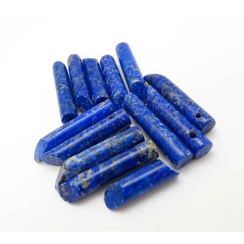 897 - A quantity of lapis lazuli hardstone beads of cylindrical form. Approx. 1 1/2