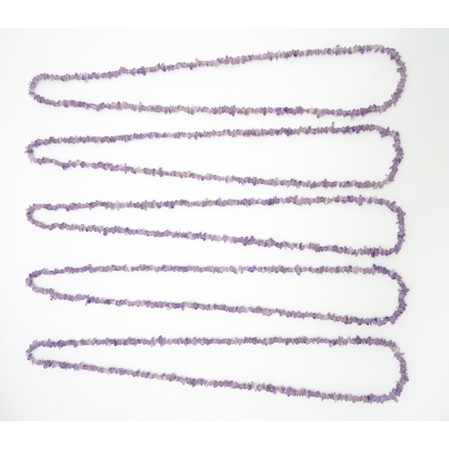 899 - Four amethyst chip bead necklaces. Approx. 36