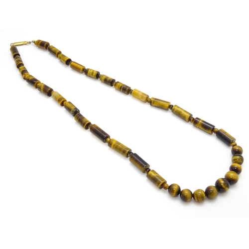 900 - Assorted tigers eye bead necklaces. Longest approx. 34