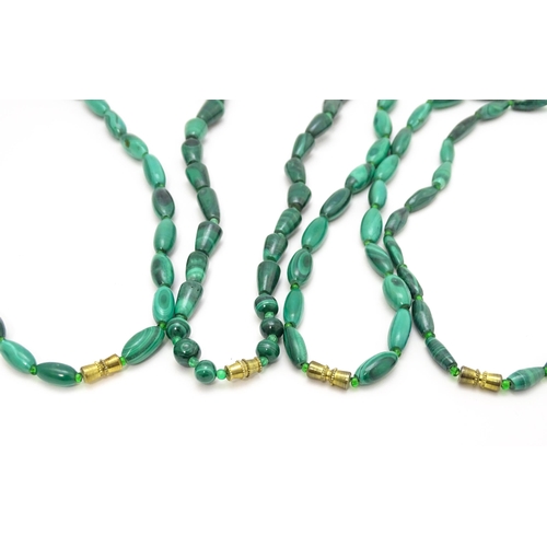 901 - Four assorted malachite bead necklaces. Longest approx. 22