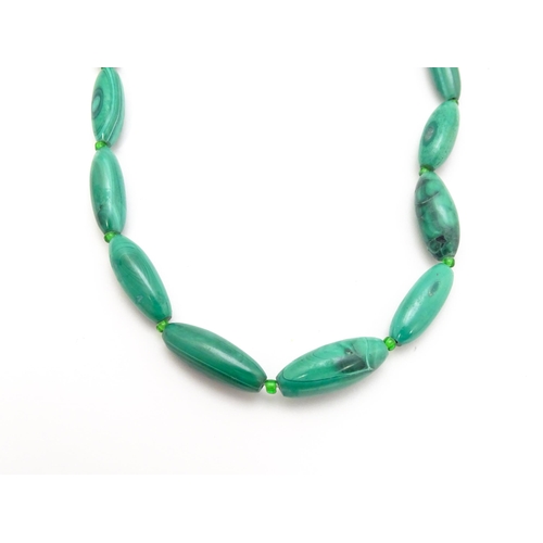 901 - Four assorted malachite bead necklaces. Longest approx. 22