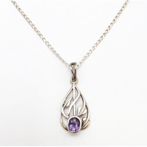 907 - A silver pendant set with amethyst on a silver chain. Pendant approx. 1