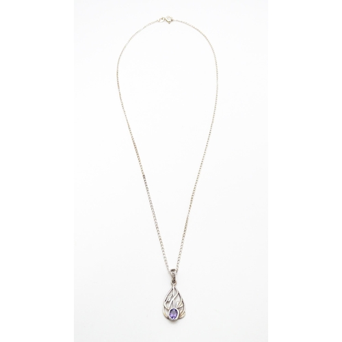 907 - A silver pendant set with amethyst on a silver chain. Pendant approx. 1