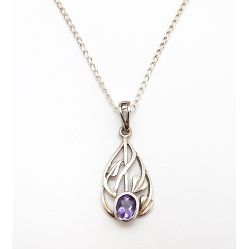 907 - A silver pendant set with amethyst on a silver chain. Pendant approx. 1