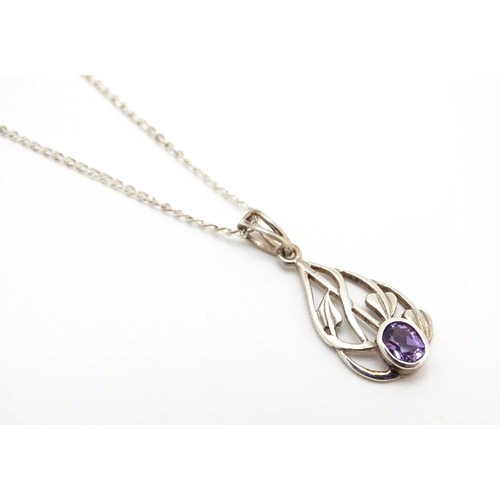 907 - A silver pendant set with amethyst on a silver chain. Pendant approx. 1