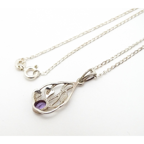 907 - A silver pendant set with amethyst on a silver chain. Pendant approx. 1