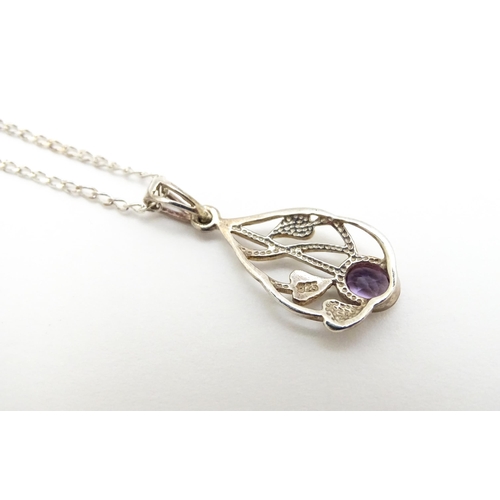 907 - A silver pendant set with amethyst on a silver chain. Pendant approx. 1