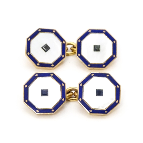 919 - A pair of 9ct gold cufflinks of octagonal form with mother of pearl and enamel detail. Approx. 1/2