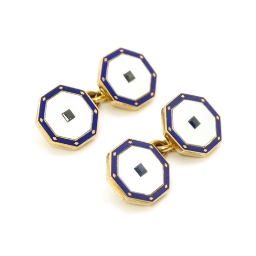 919 - A pair of 9ct gold cufflinks of octagonal form with mother of pearl and enamel detail. Approx. 1/2