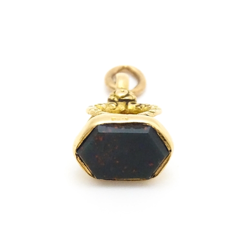 920 - A 9ct gold fob set with bloodstone seal. Approx. 3/4