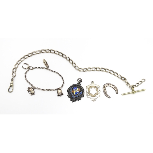 922 - A quantity of assorted silver and white metal items to include a watch chain, good luck charm of hor... 