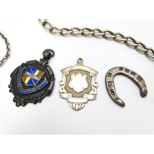 922 - A quantity of assorted silver and white metal items to include a watch chain, good luck charm of hor... 