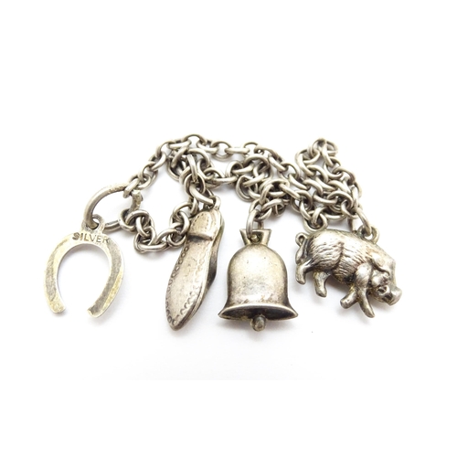 922 - A quantity of assorted silver and white metal items to include a watch chain, good luck charm of hor... 