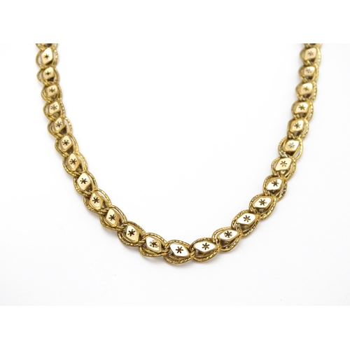 923 - A rolled gold / plated watch chain with star detail. Approx. 18