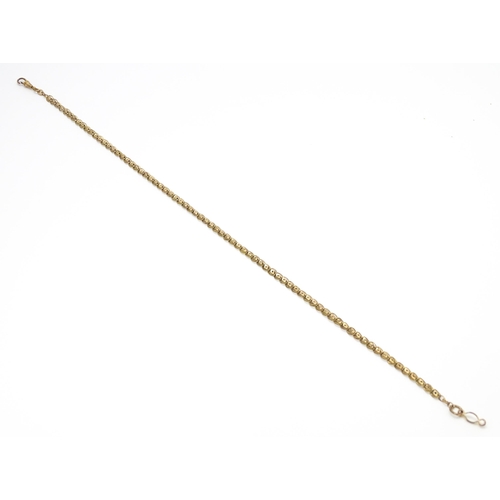 923 - A rolled gold / plated watch chain with star detail. Approx. 18