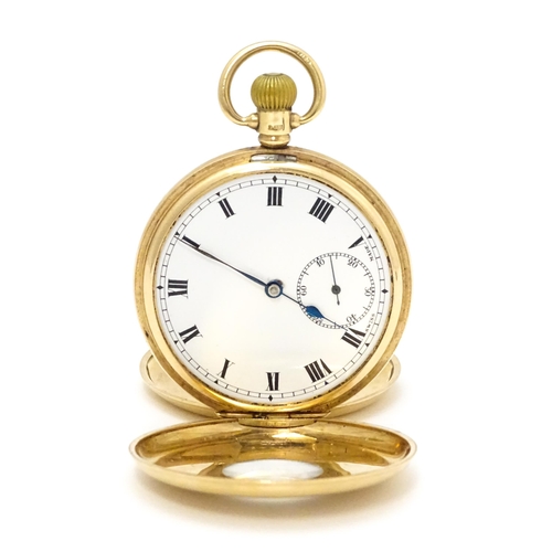 927 - A 9ct gold cased half hunter side wind pocket watch, the white enamel dial with Roman numerals and s... 