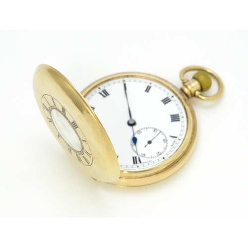 927 - A 9ct gold cased half hunter side wind pocket watch, the white enamel dial with Roman numerals and s... 