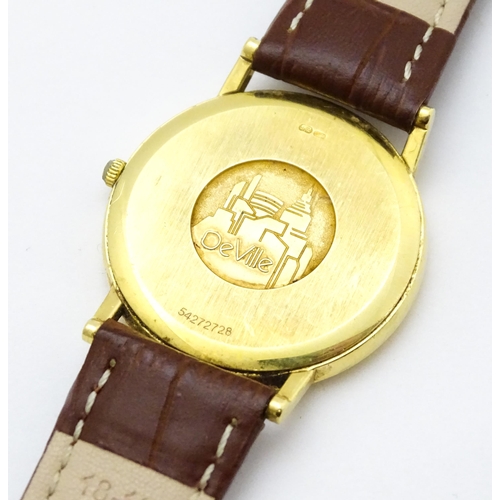 950 - An Omega 18ct gold cased De Ville wristwatch, the dial with hour batons and date aperture. Watch cas... 