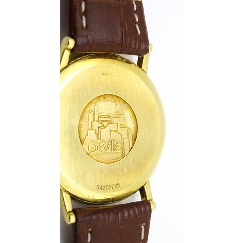 950 - An Omega 18ct gold cased De Ville wristwatch, the dial with hour batons and date aperture. Watch cas... 