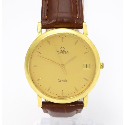 950 - An Omega 18ct gold cased De Ville wristwatch, the dial with hour batons and date aperture. Watch cas... 