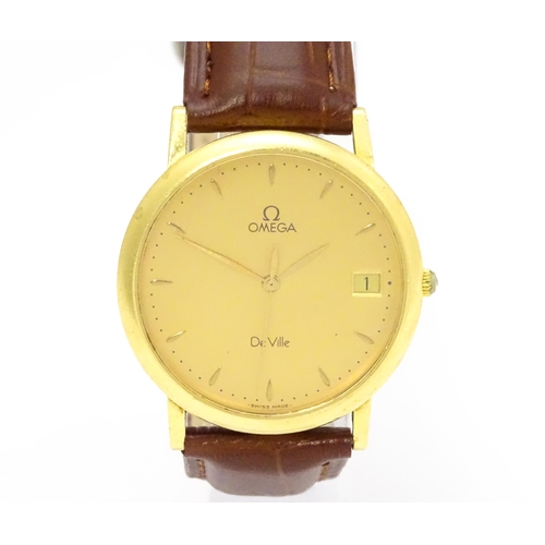 950 - An Omega 18ct gold cased De Ville wristwatch, the dial with hour batons and date aperture. Watch cas... 