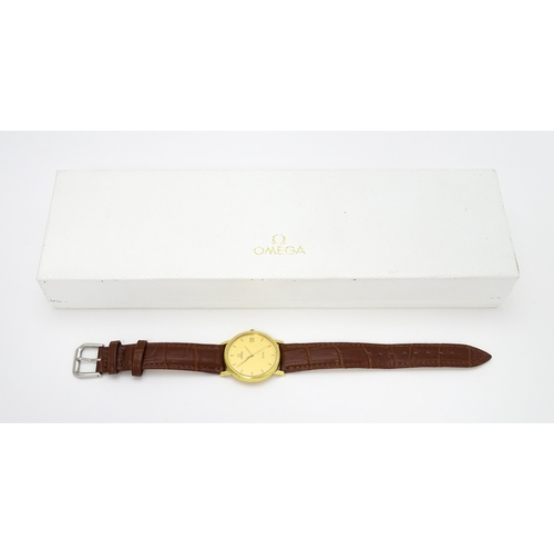 950 - An Omega 18ct gold cased De Ville wristwatch, the dial with hour batons and date aperture. Watch cas... 